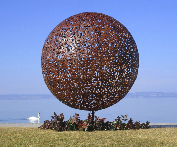 Rusty iron ball garden artwork